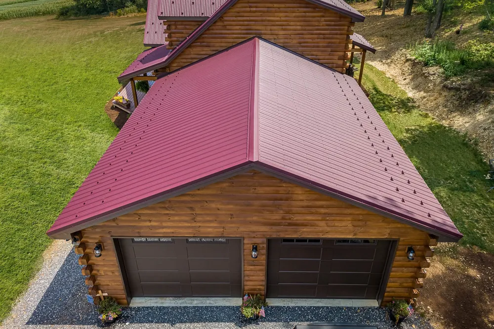 Log home with red standing-seam metal roof, photo 4