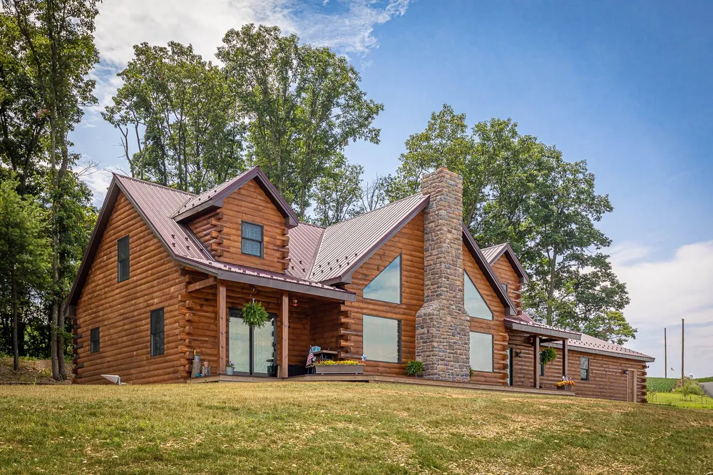Log home with red standing-seam metal roof, photo 5