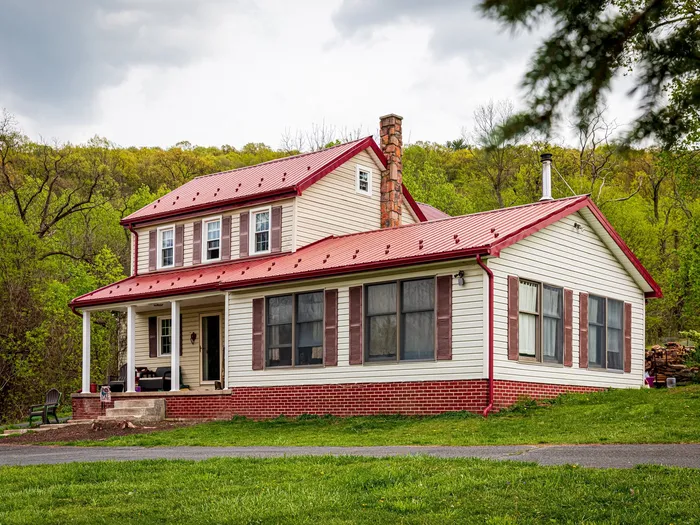 Farmhouse windows & red metal roof