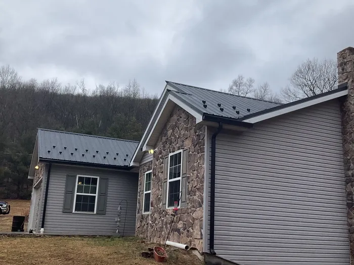 Black Metal Roof Replacement and Gutter Installation in Halifax