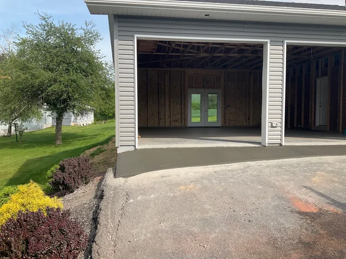 Tower City Residential Addition Featuring Gray Vinyl Siding and Garage
