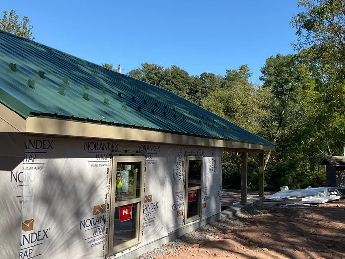 Detached Garage Construction with Vinyl Siding and Metal Roof