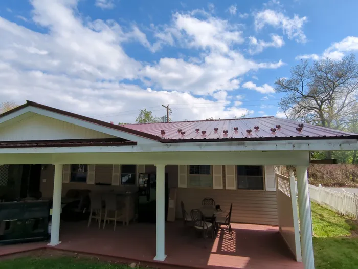 Maroon ABM Metal Roof Replacement and Gutter Installation in Shenandoah