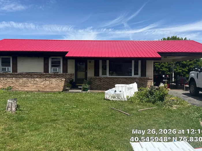 Red ABM Panel Metal Roofing Installation on Elizabethville Ranch Home