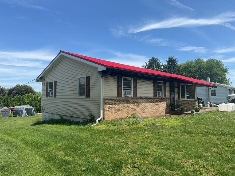 Red ABM Panel Metal Roofing Installation on Elizabethville Ranch Home, Elizabethville, PA, photo 3