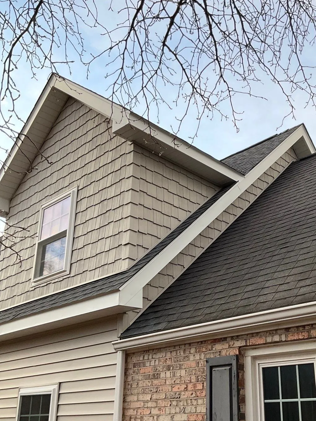 Staggered-edge shake siding on a home gable, installed by Esh Builders